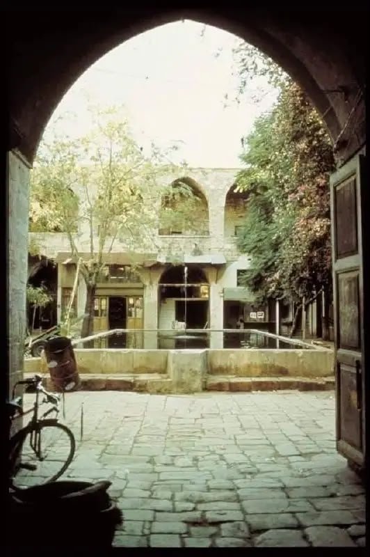 The original Khan Al Saboun in Tripoli, seen through a stone arch